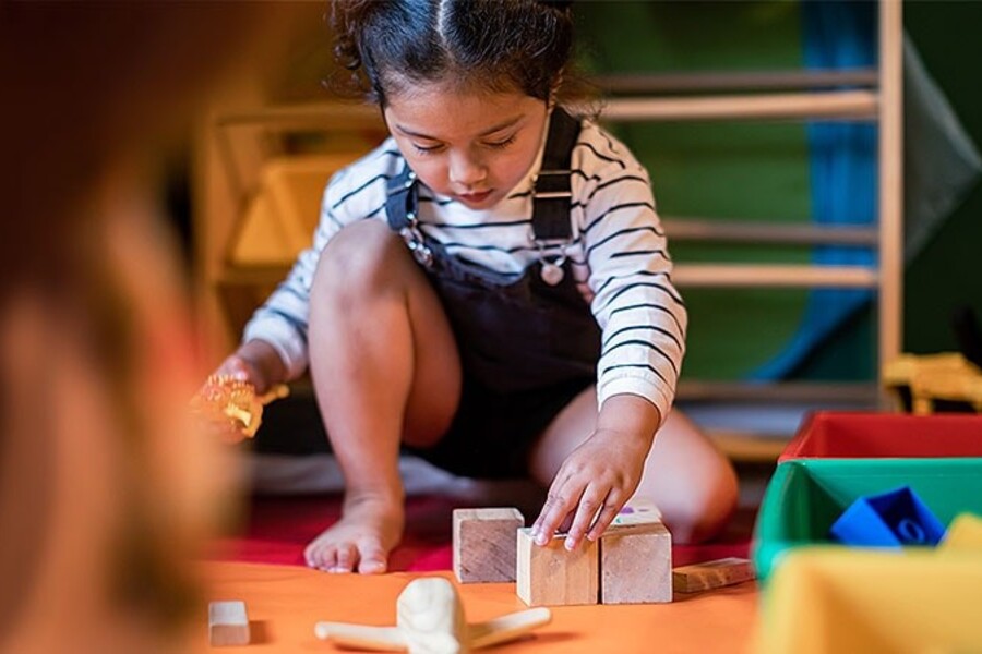 Child playing building blocks