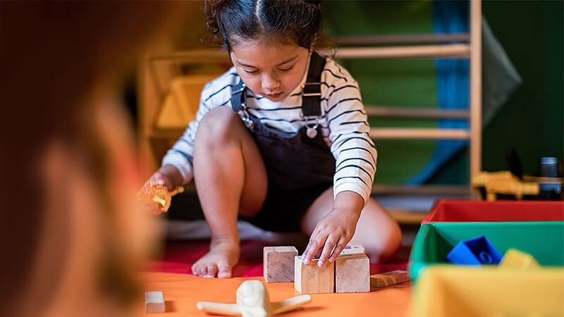 Child playing building blocks